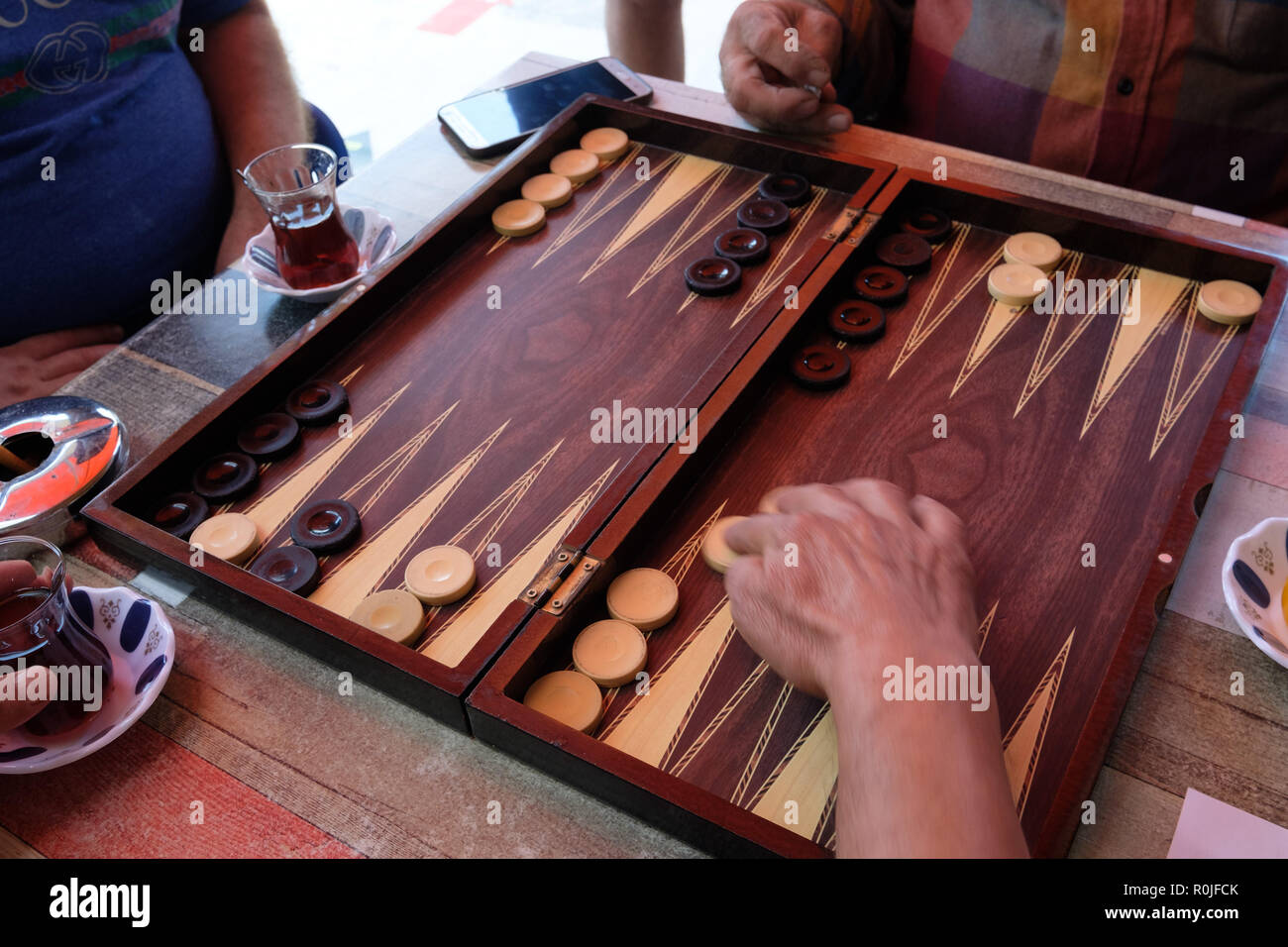 Close up of people playing Backgammon Stock Photo