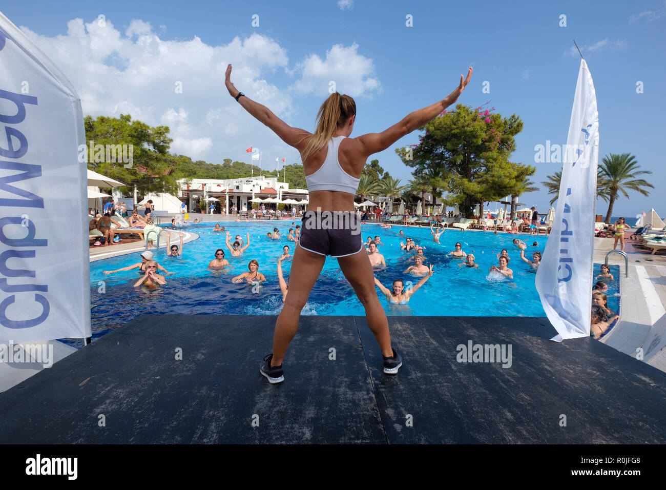 Water aerobics instructor during pool activities at the Club Med Palmiye luxury all inclusive resort, Kemer, Antalya, Turkey Stock Photo