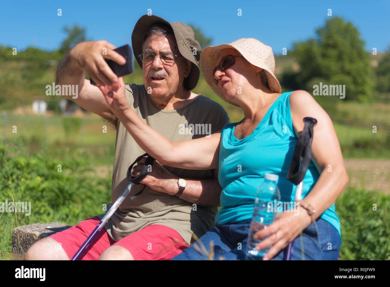 Senior couple on hike taking a selfie Stock Photo