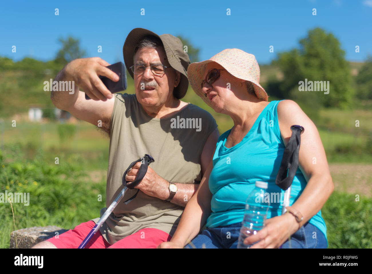 Senior couple on hike taking a selfie Stock Photo