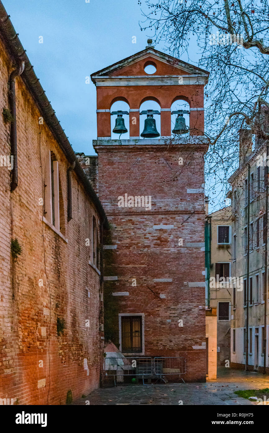 Night scene exterior old church bell tower at historic center of venice, Italy Stock Photo