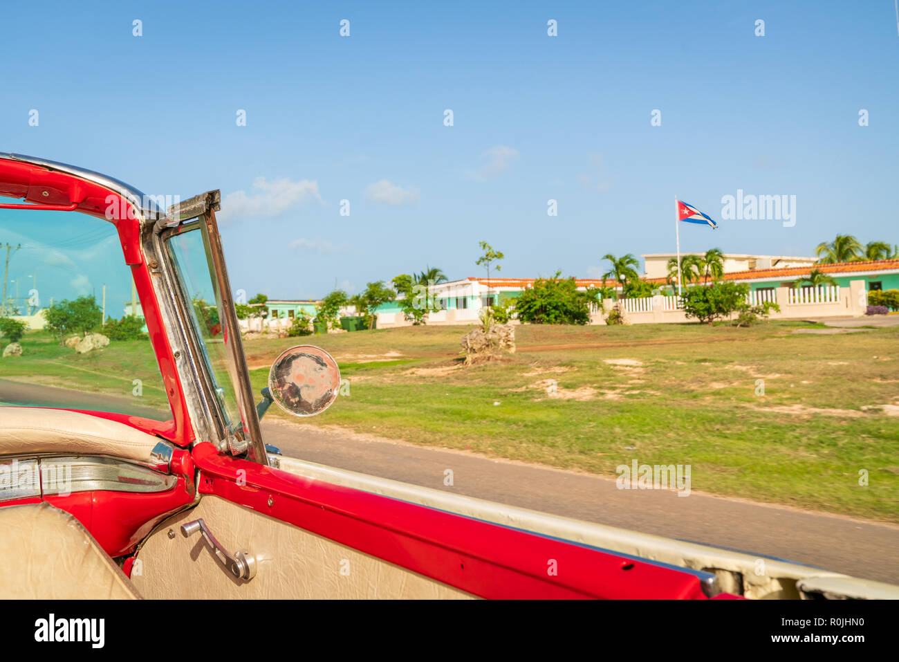 Cuba Varadero, view inside an old vintage classic american car on the right Cuban flag,sunny day. Stock Photo