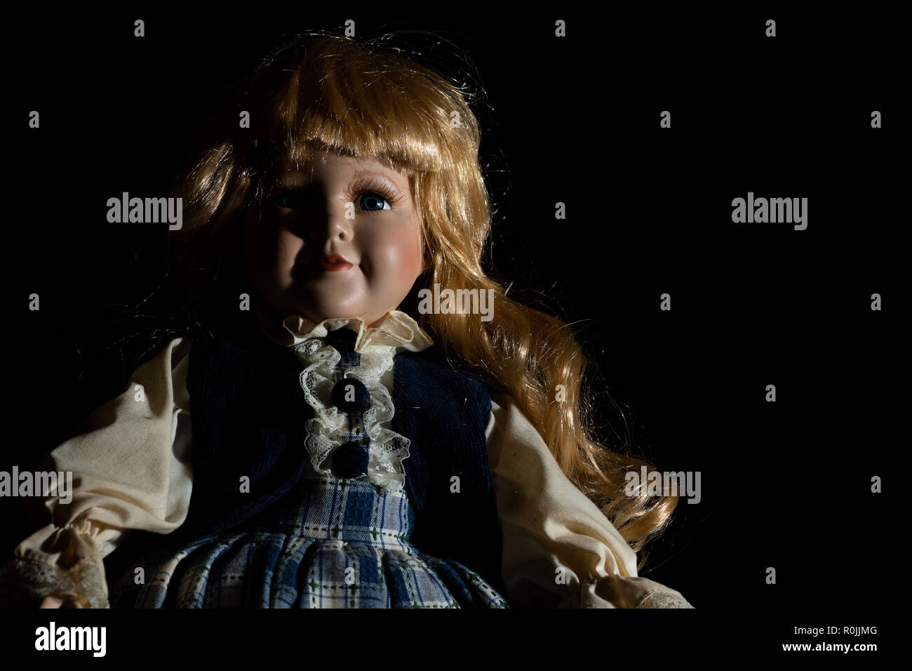 creepy black doll
