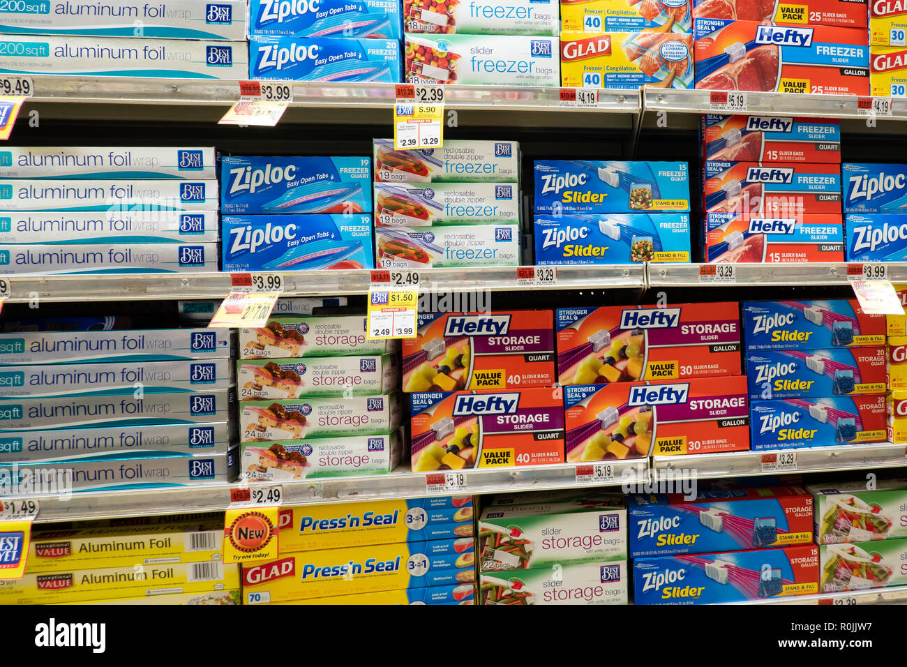 Shelves full of aluminum foil and plastic storage bags for sale on display in a small grocery store in Speculator, NY USA Stock Photo