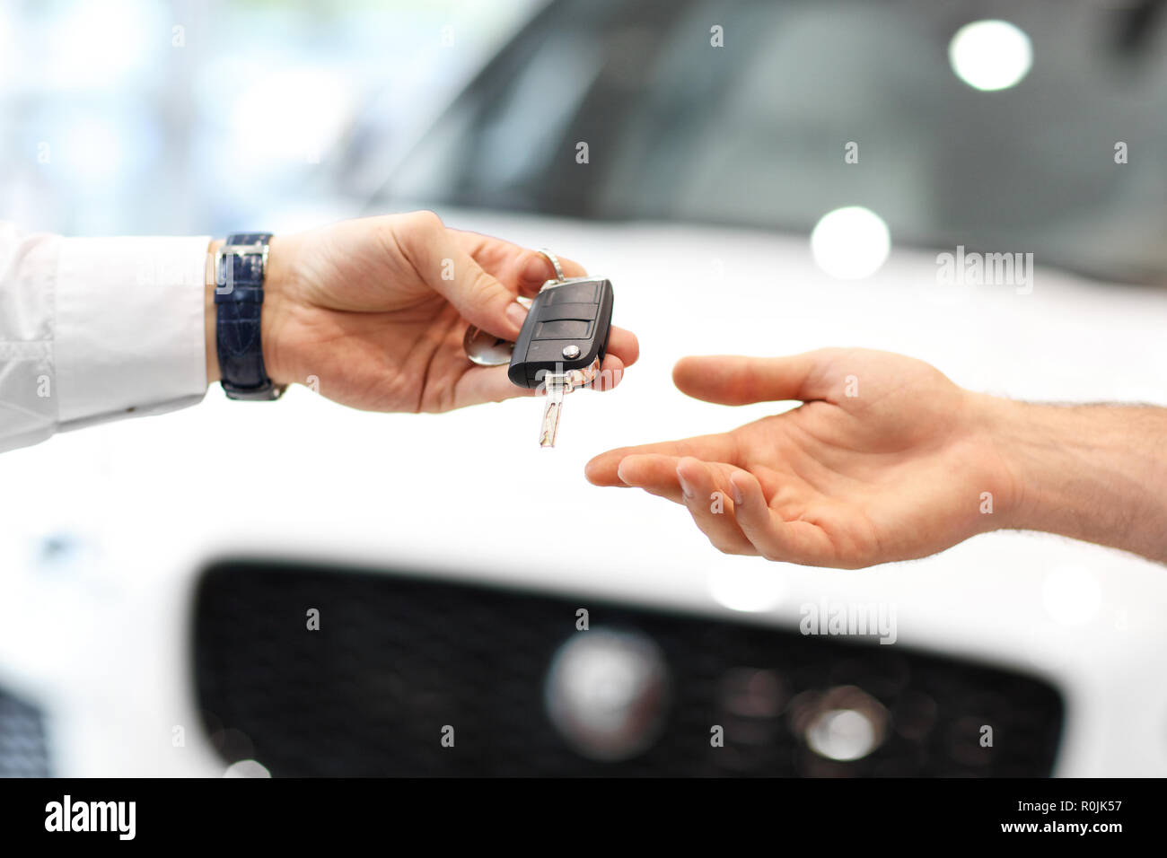 Midsection of young couple buying new car Stock Photo