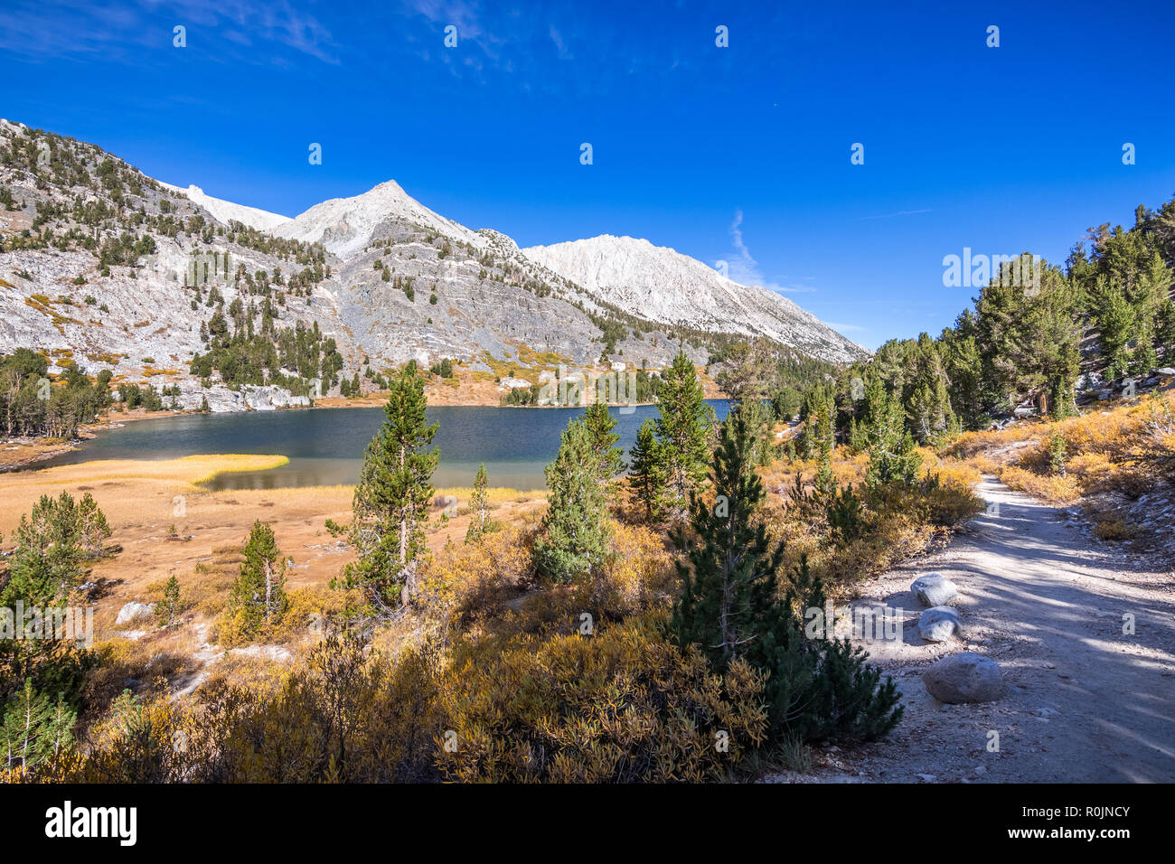 Hiking trail following the shoreline of Long Lake, Little Lakes Valley trail, John Muir wilderness, Eastern Sierra mountains, California Stock Photo