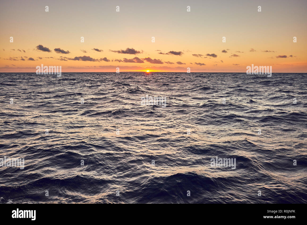 Picture of a sea at sunset, color toning applied. Stock Photo