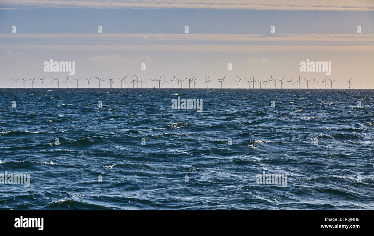 Panoramic view of an offshore wind farm, clean energy concept. Stock Photo