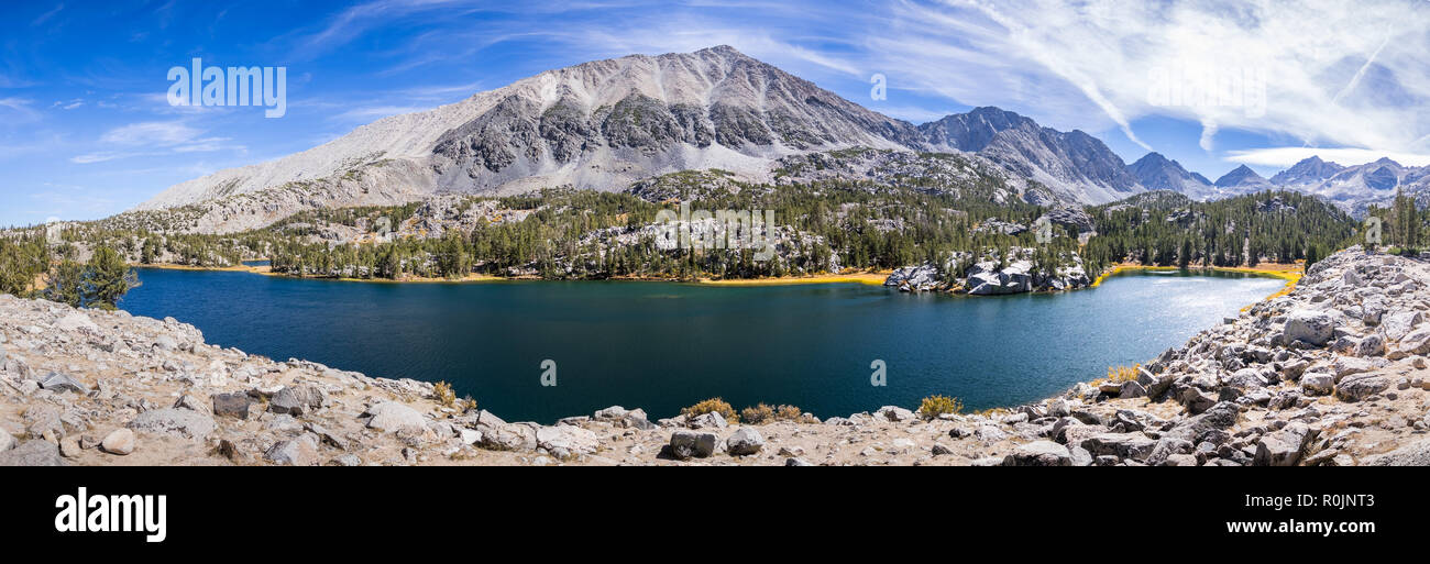 Panoramic view of alpine lake surrounded by the rocky ridges of the Eastern Sierra mountains; Box Lake, Little Lakes Valley trail, John Muir wildernes Stock Photo