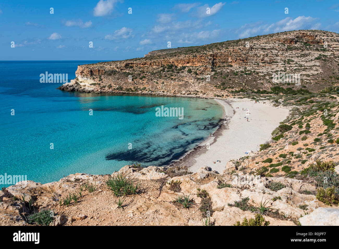 Crystal clear water at the Rabbit beach (Spiaggia dei Conigli) in the Pelagie IslandLampedusa. Sicily. Stock Photo