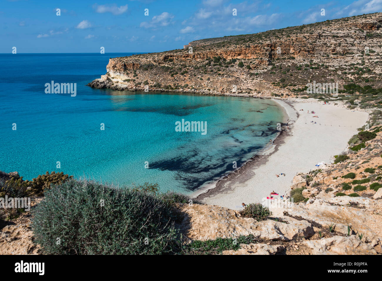 Crystal clear water at the Rabbit beach (Spiaggia dei Conigli) in the ...