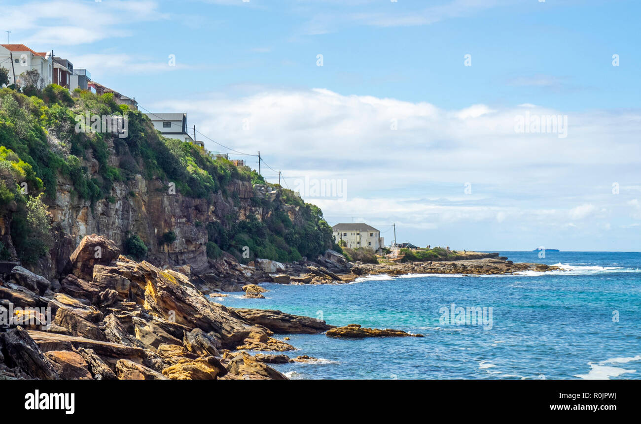 Rocky sandstone cliffs of Gordons Bay Pacific Ocean Sydney NSW Australia. Stock Photo