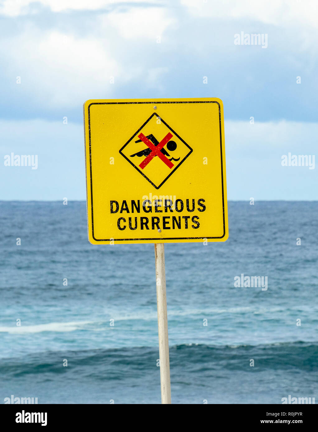 Yellow sign at Bronte Beach closed because of dangerous currents Sydney NSW Australia. Stock Photo