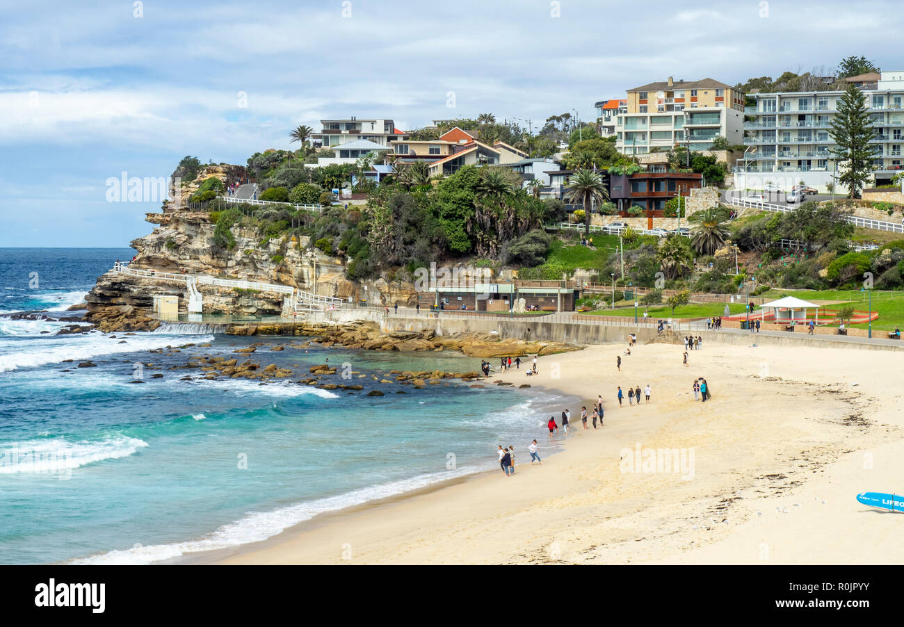 Bondi to Coogee coastal walk Bronte Beach and dwellings on sandstone cliff over Pacific Ocean