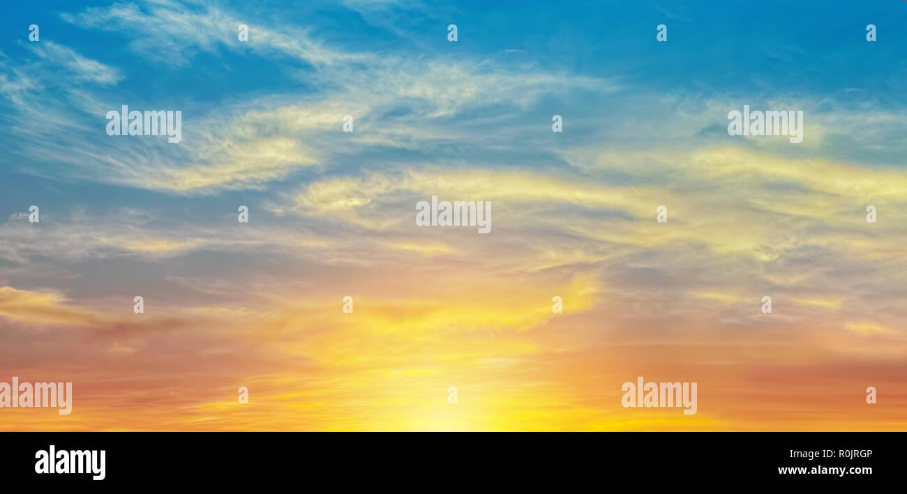 bright orange sunset sky with sun light wide nature for banner background Stock Photo