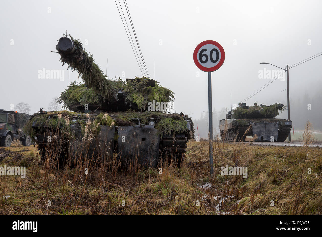 German main battle tank Leopard 2 securing the assembly area of the German battle group. NATO exercise Trident Juncture, in Norway, Engerdal, at November 03, 2018.     Photo: SGM Marco Dorow, German Army. Stock Photo