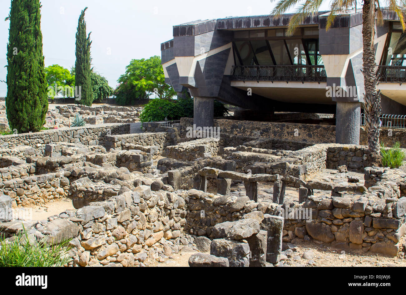 3 May 2018 The excavated ruins close to the first century Jewish Synagogue overlooked by a modern building in the ancient town of Capernaum in Israel Stock Photo