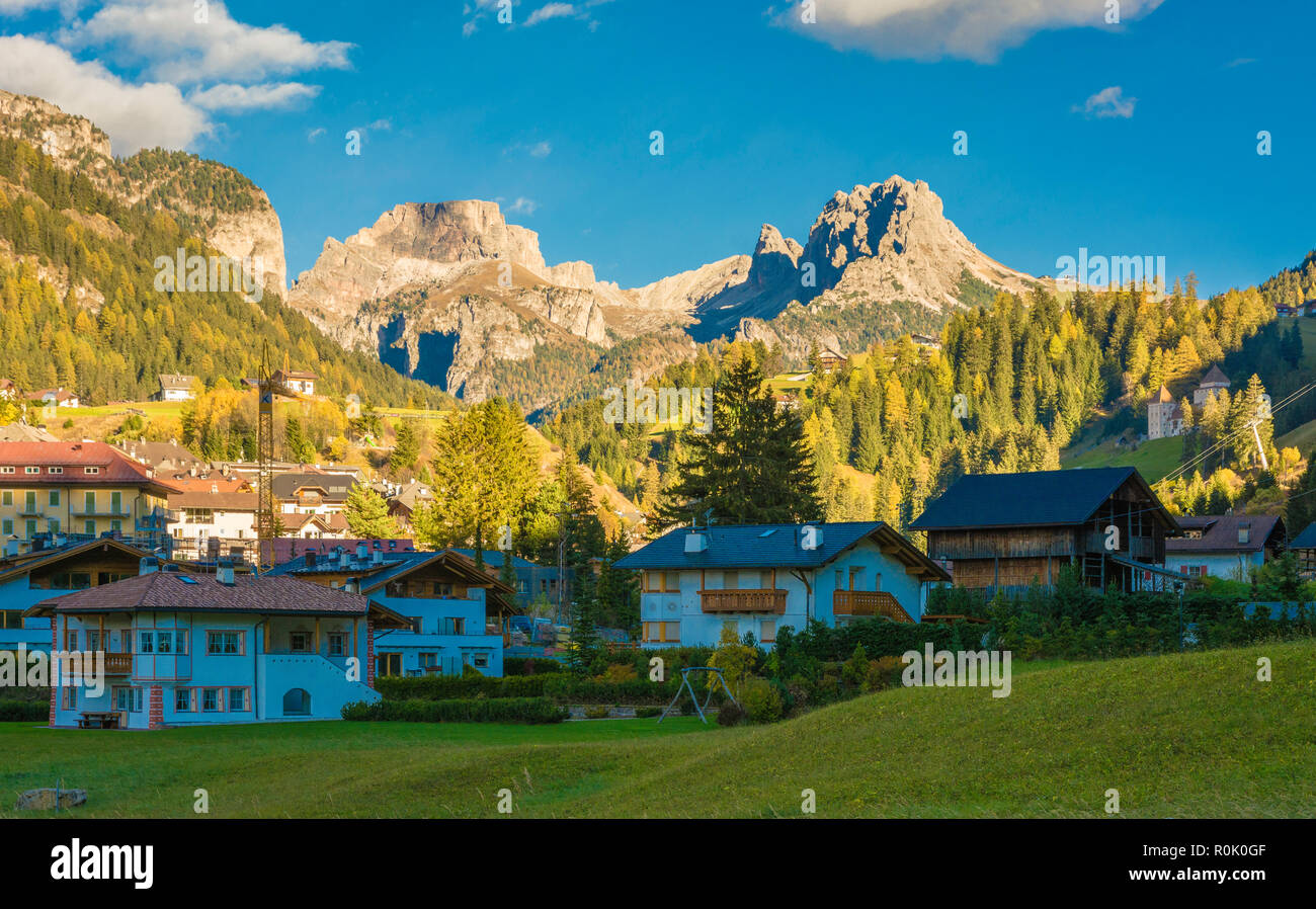 autumn landscape in Gardena Valley. The town of Santa Cristina (St. Christina in Groden) with the light of the sunset, located in the heart of Dolomit Stock Photo