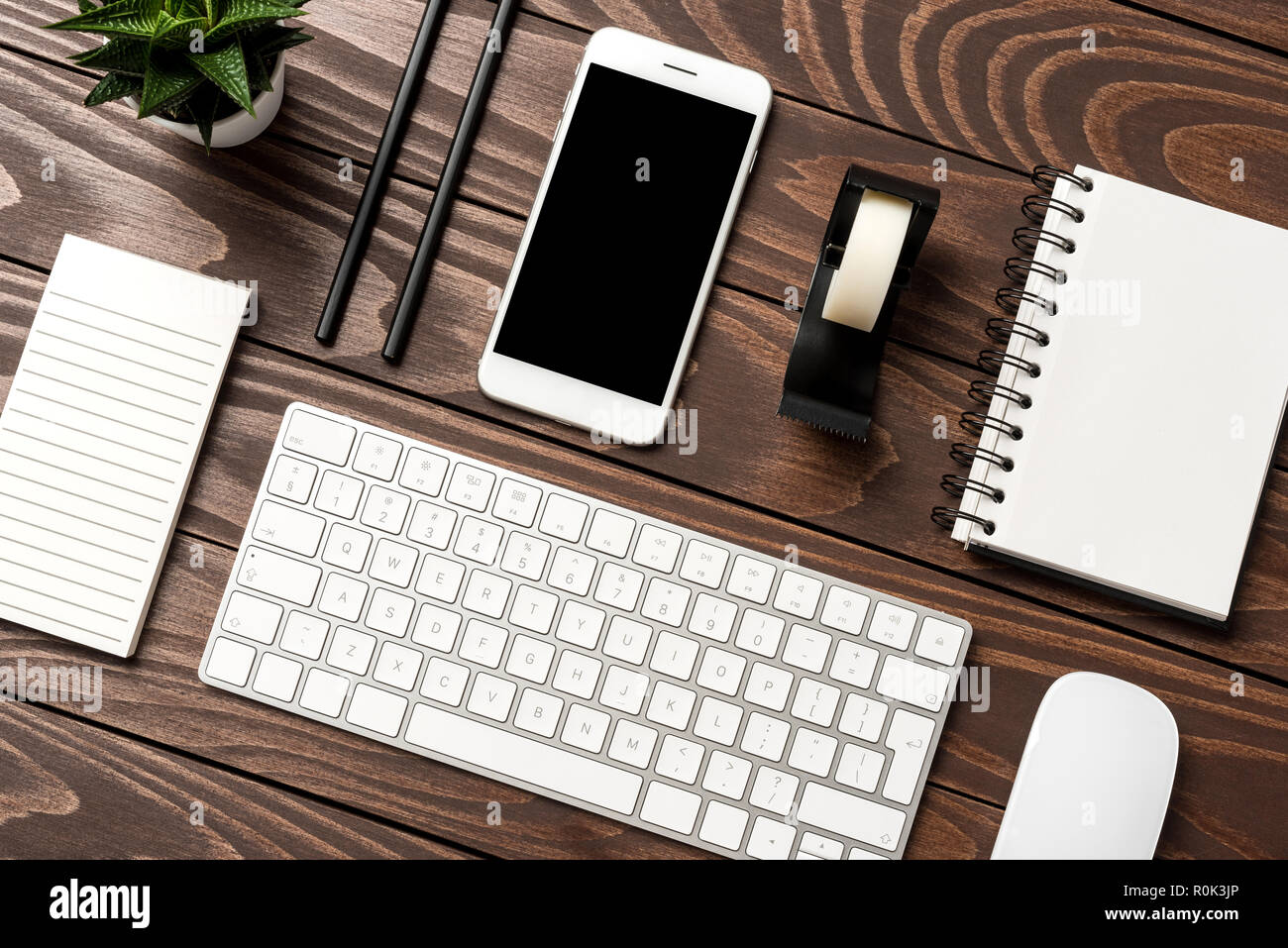 Overhead shot of office desktop Stock Photo - Alamy