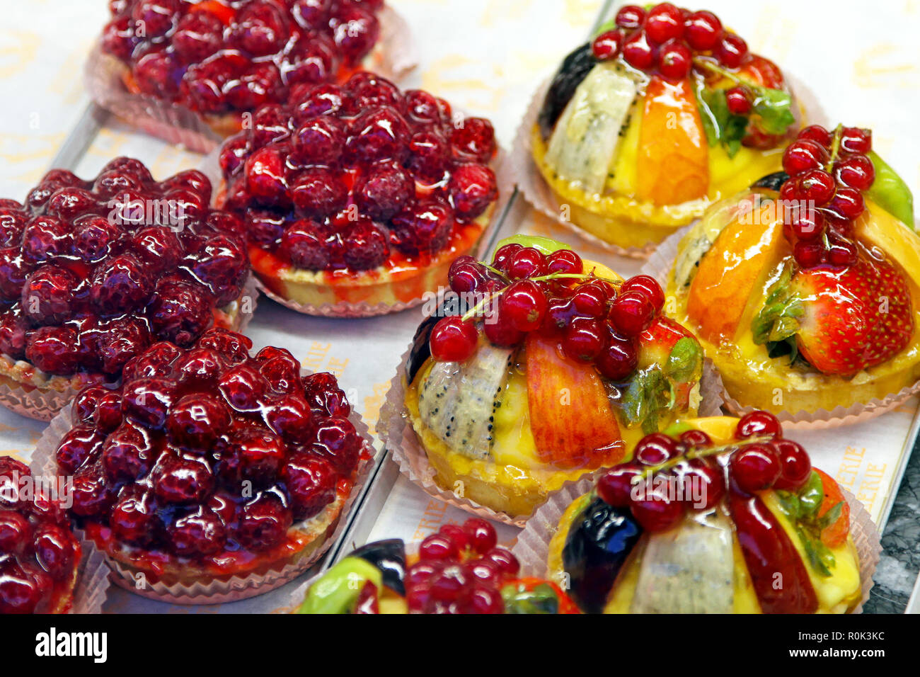 Bunch of decorative tasty tart fruit cakes Stock Photo