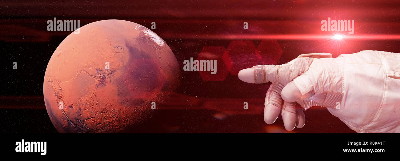 astronaut pointing to Mars  (3d illustration background banner, elements of this image are furnished by NASA) Stock Photo