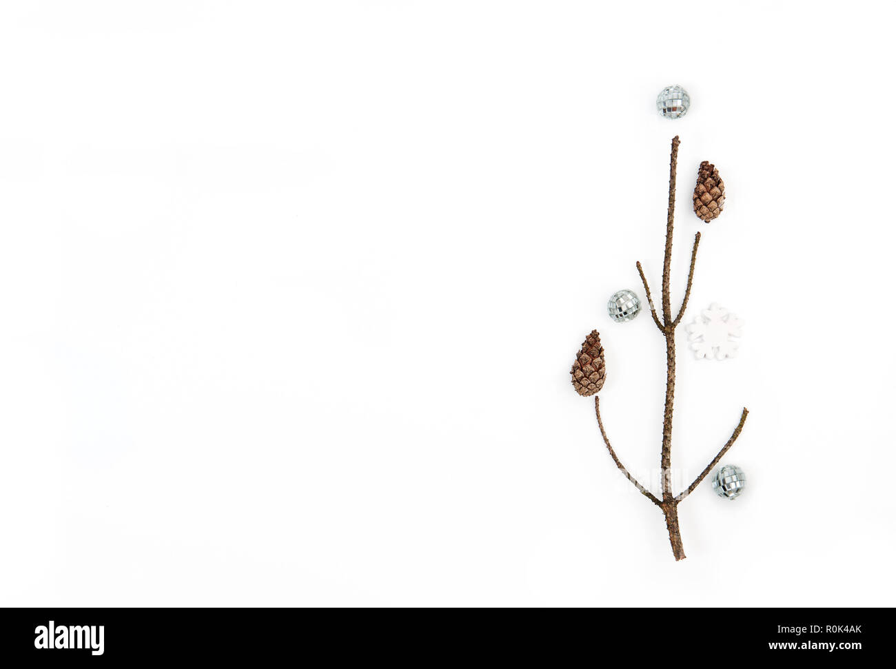 Christmas tree made of branches and silver decorations. Christmas