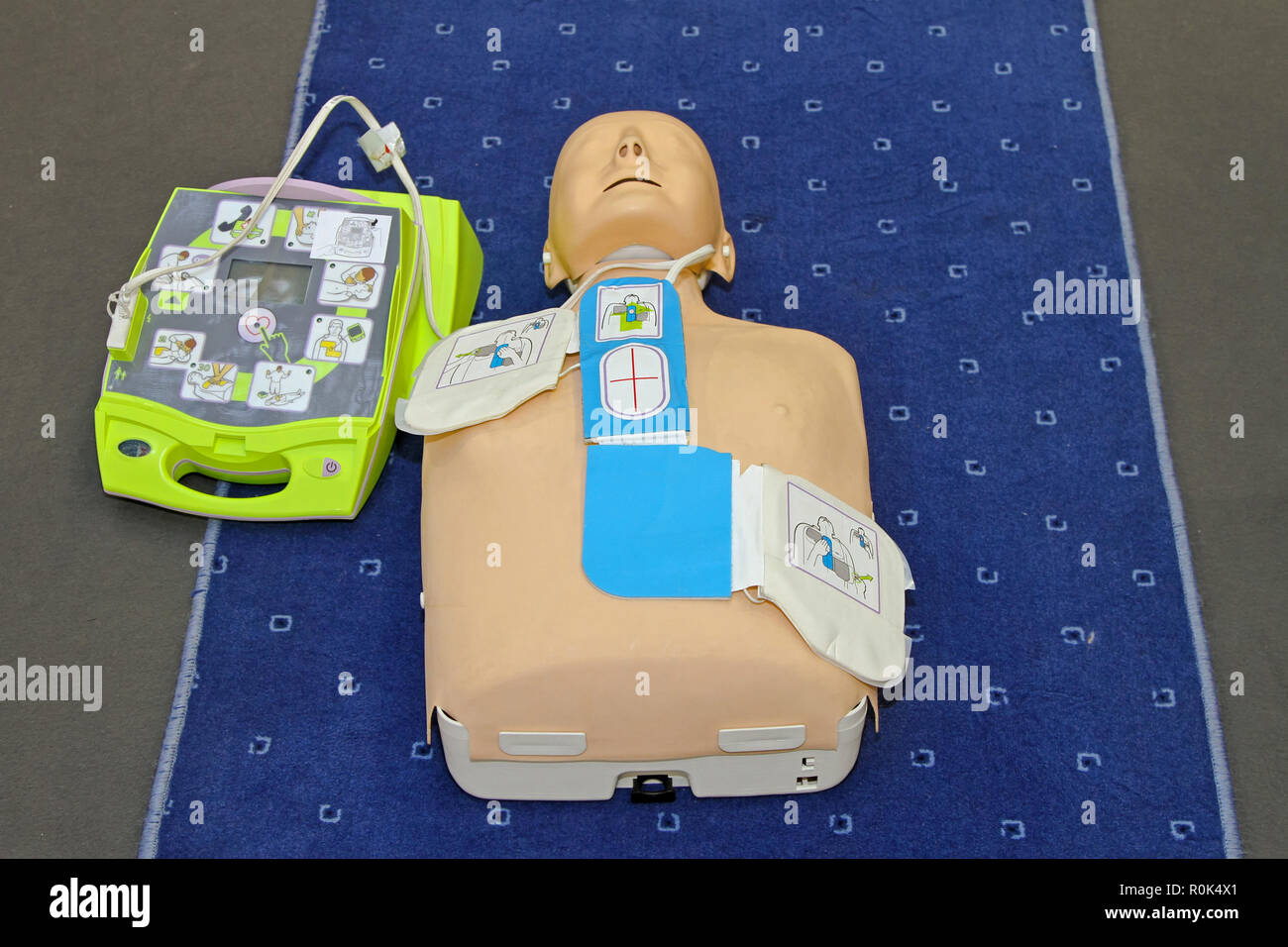 Automated External Defibrillator with training dummy mannequin Stock