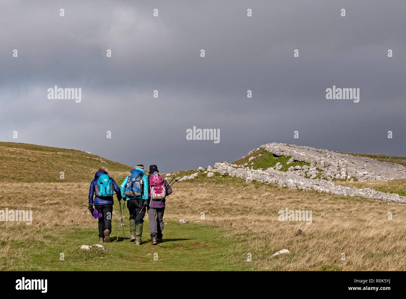 Three women walking the Dales Way between Grassington and Kettlewell in the autumn Stock Photo