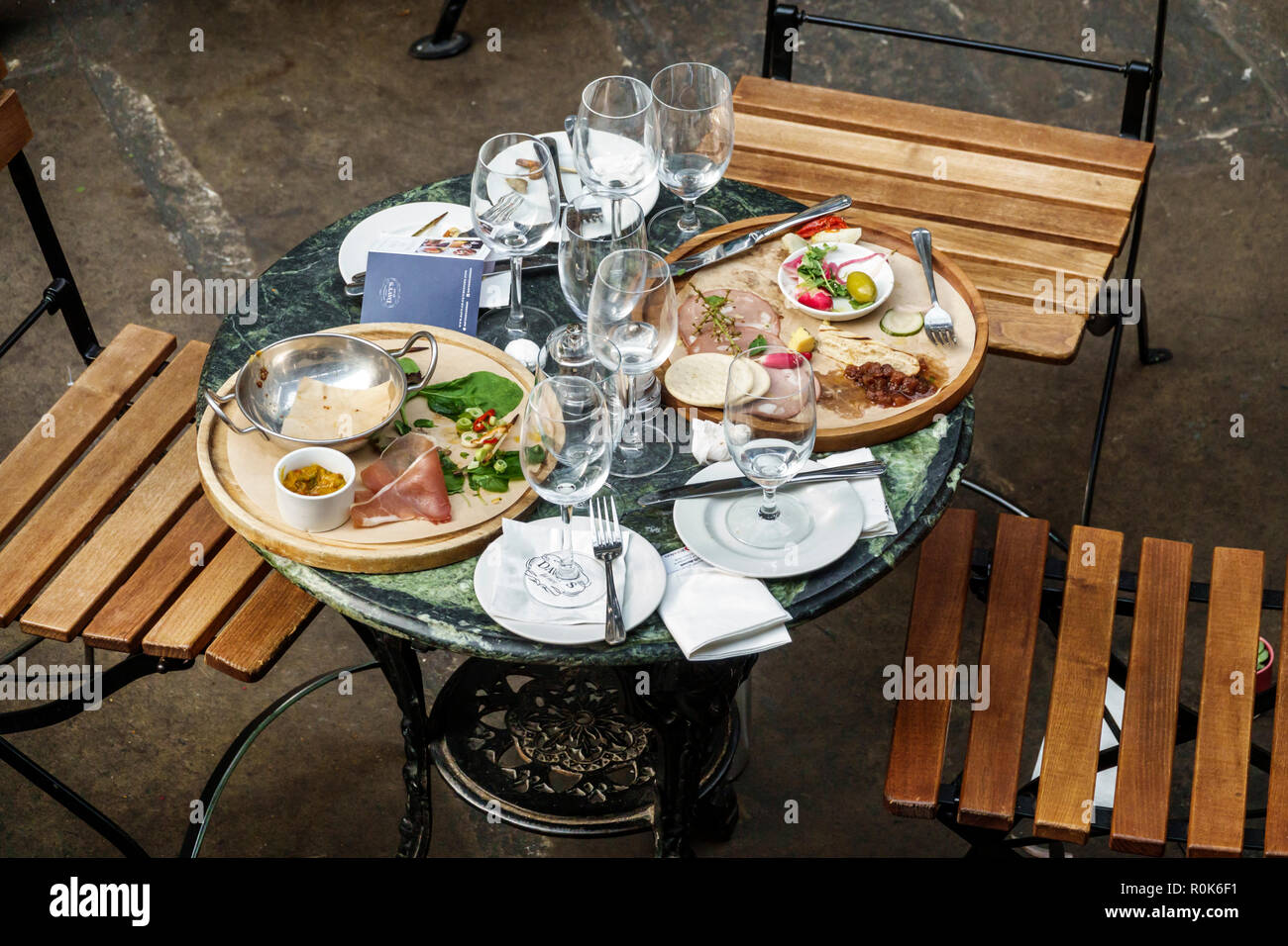 London England,UK,Covent Garden,market,shopping dining entertainment,central hall building,table,finished meal,dirty plates,empty glasses,silverware,l Stock Photo