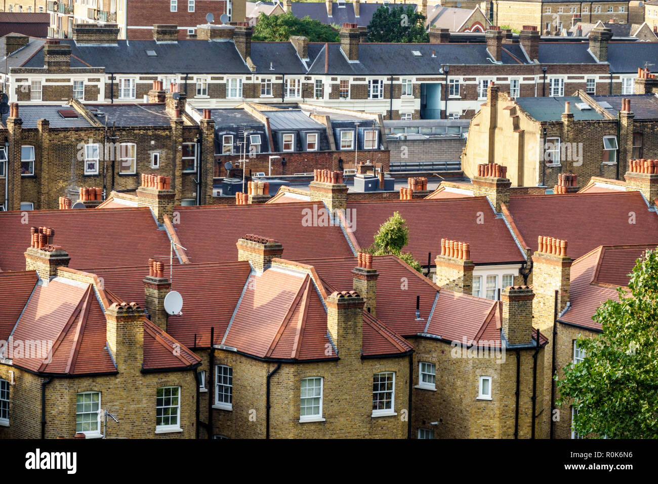 London England,UK,Lambeth South Bank,terraced row houses,rooftops,identical mirror image houses,townhomes,chimneys,tiled roof,brick,UK GB English Euro Stock Photo