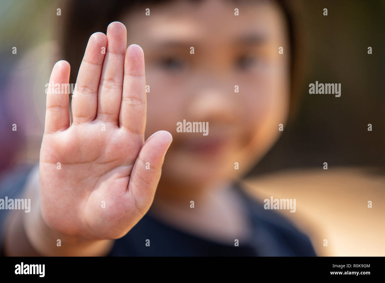 Stop harassment child and stop violence abuse in child. Hand stop no. Stock Photo