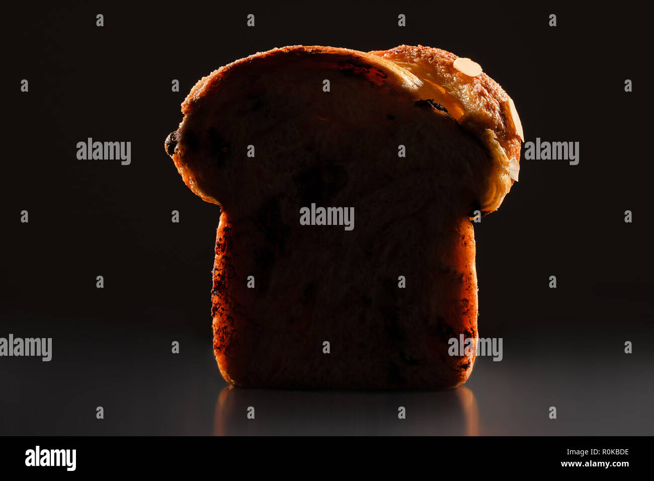 Easter bread with chocolate and almonds isolated on white background. Stock Photo