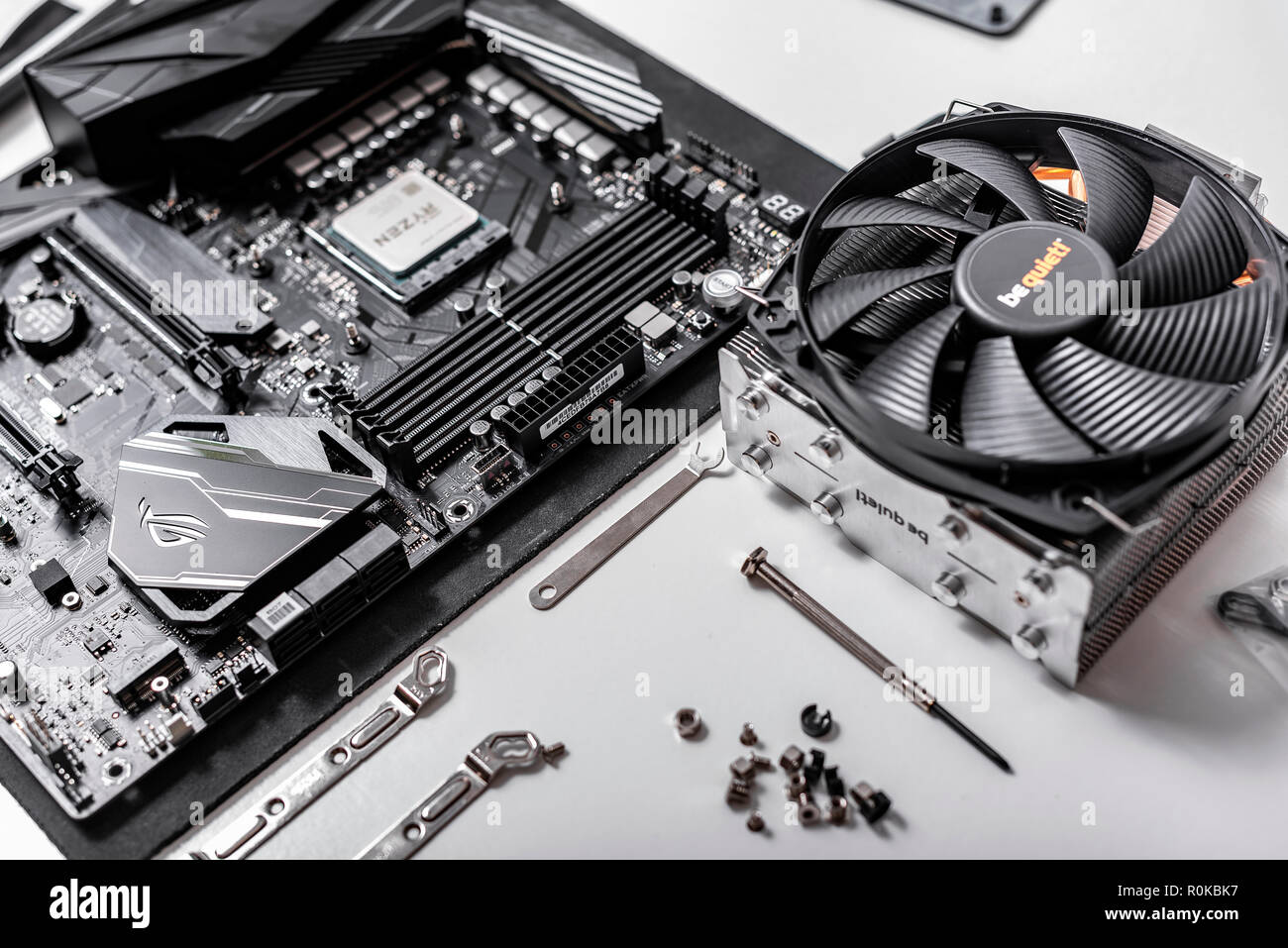 Processor Ryzen 7 2700X against the background of a computer motherboard  Asus rog crosshair vii hero, and cooler be quiet Stock Photo - Alamy