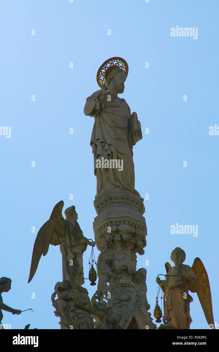 Venice, Basilica San Marco, statue of the facade with a perforated halo and  angels with thuribles Stock Photo - Alamy