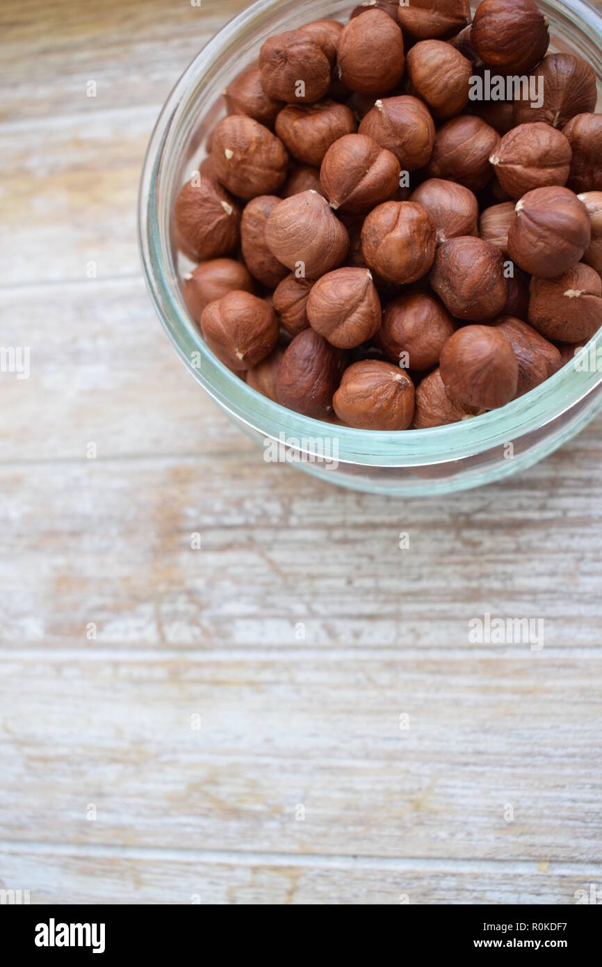 tree nuts in a glass jar isolated on white background. Vertical Stock