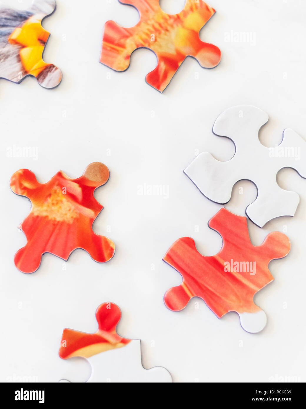 Puzzle pieces on white background. Representing solving problems, challenge, challenges, figuring out. Stock Photo