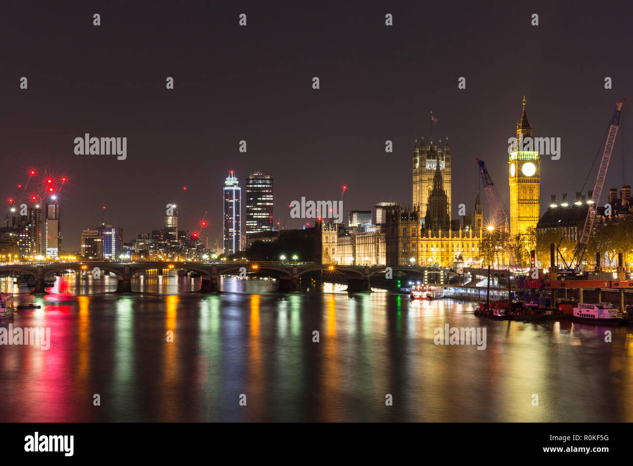 The Houses of Parliament and Big Ben from the Jubilee Bridge at night, London, England Stock Photo