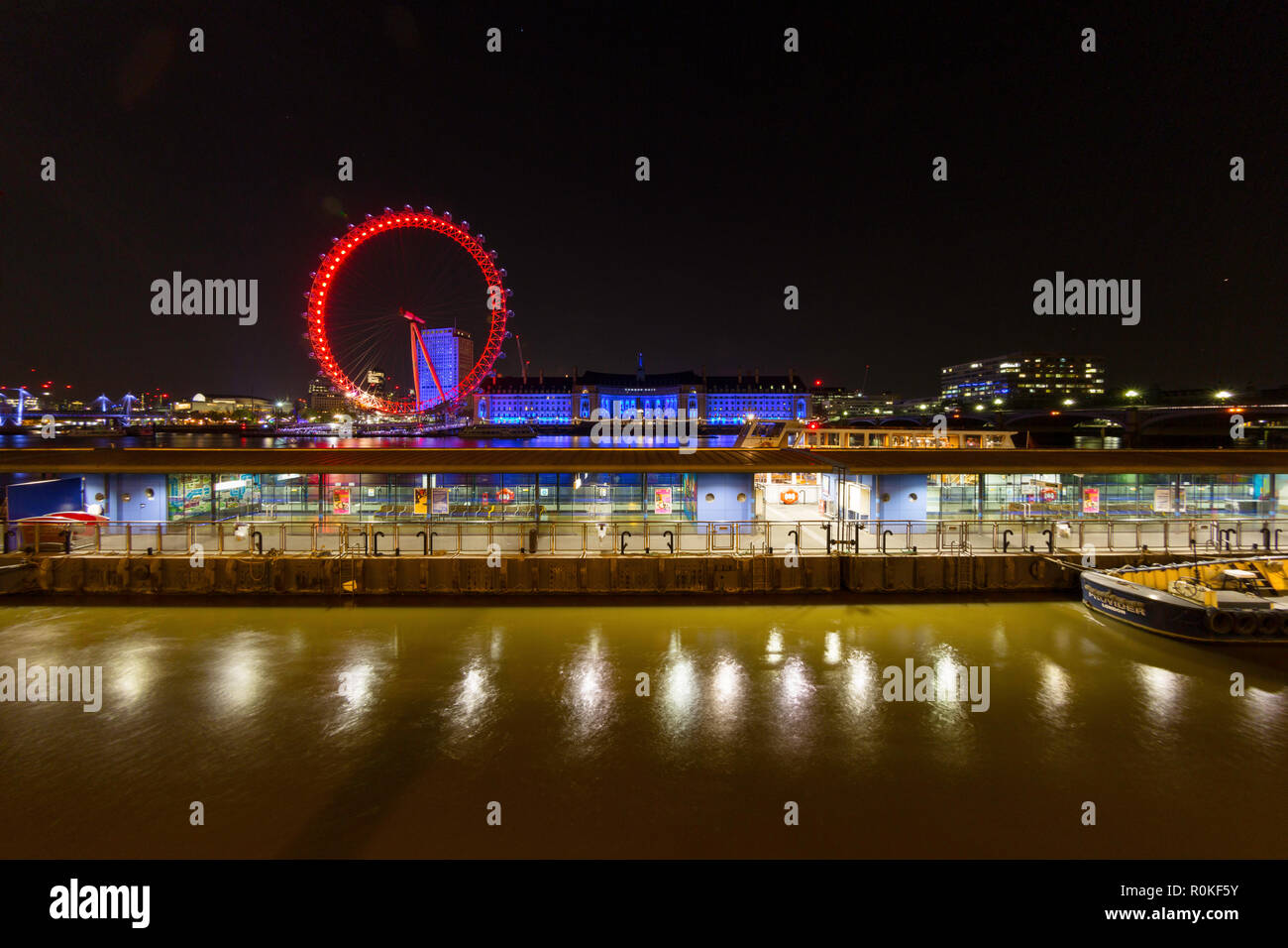 The BA London Eye and the River Thames looking east from the Victoria Embankment at night, London, England Stock Photo