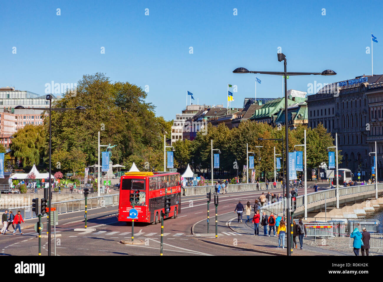 16 September 2018: Stockholm, Sweden - The city centre on a sunny Sunday in Autumn, with tourists, a sightseeing bus and the grand buildings of the... Stock Photo
