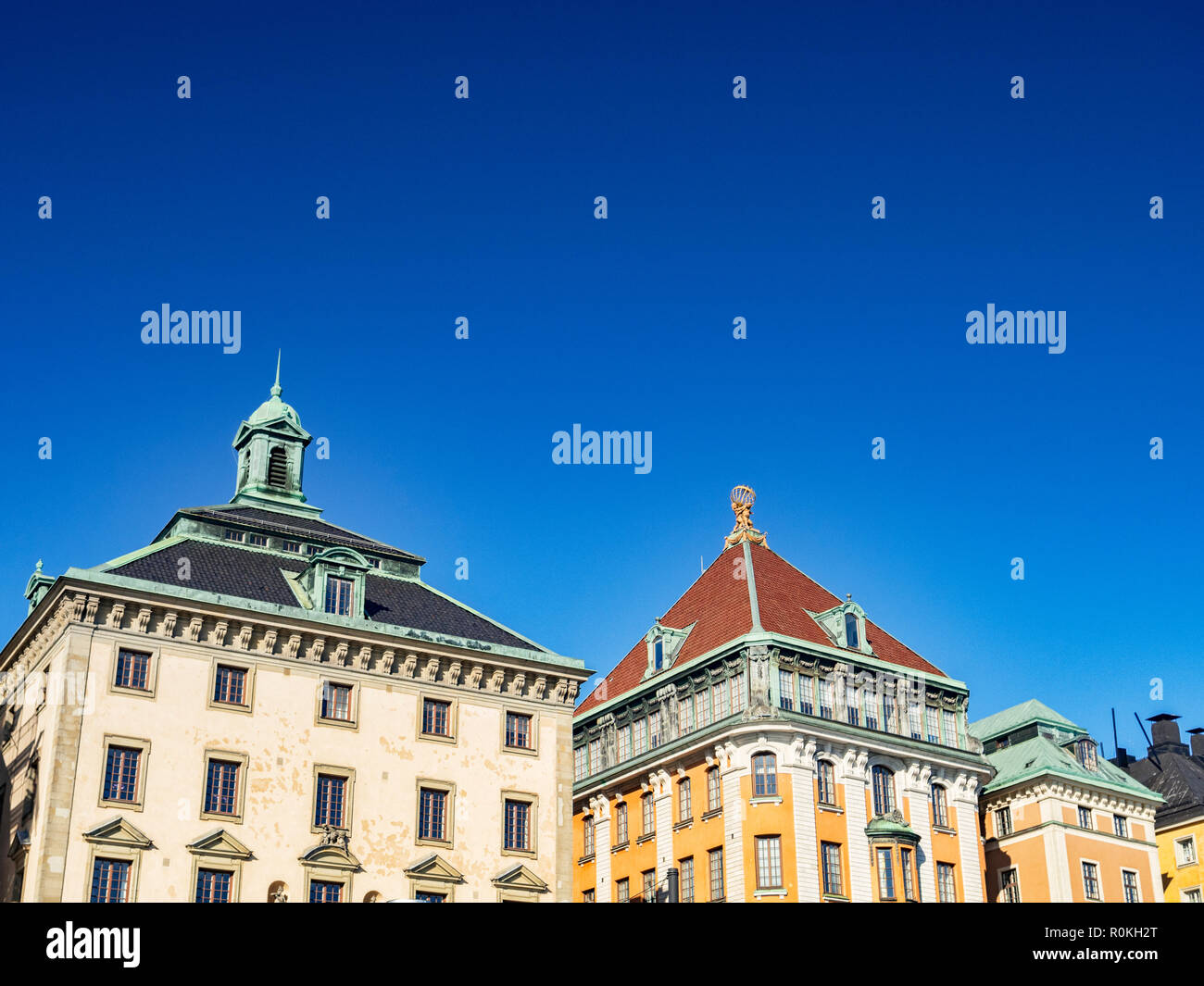 18 September 2018: Stockholm, Sweden - Traditional buildings on the waterfront of Stadsholmen, in Gamla stan, under deep clear blue sky. Stock Photo