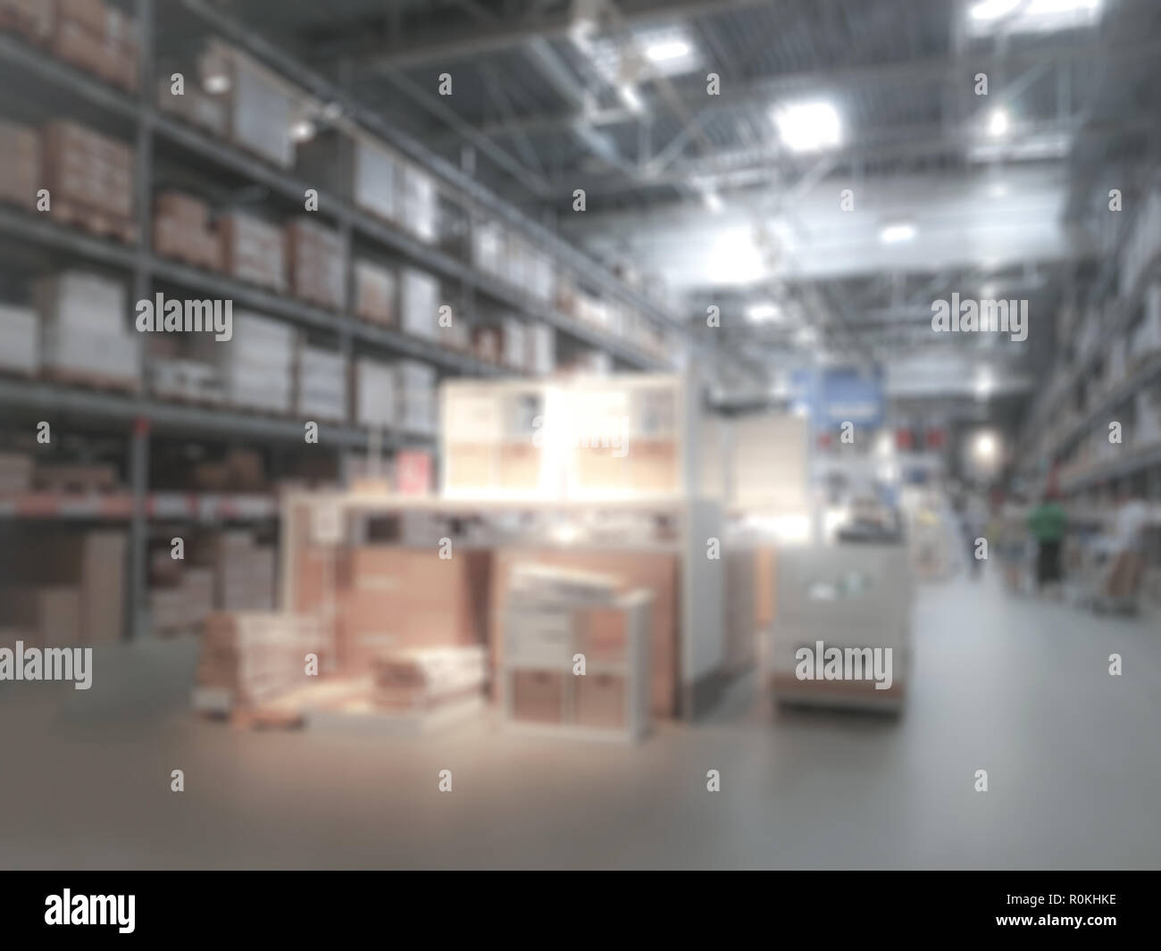Industrial background - blurred interior view of a large warehouse or logistic corporation with workers Stock Photo