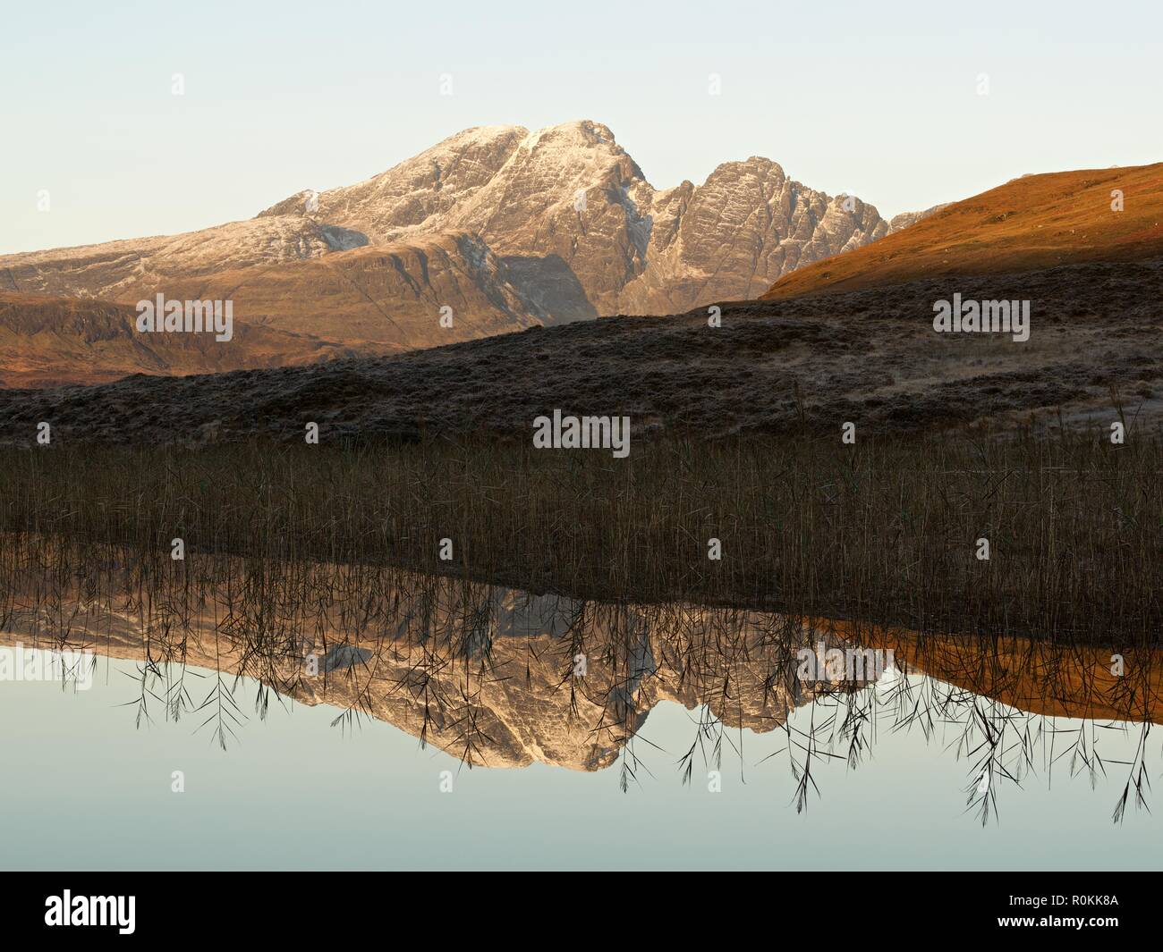 A still sunrise on the Isle of Skye. This was taken from the still waters of Loch Cill Chriosd looking to Blaven and its reflection Stock Photo