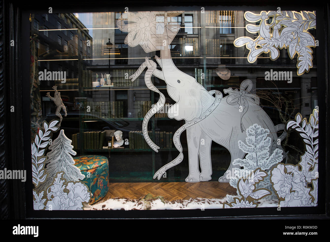 Liberty London, 10 Great Marlborough Street Christmas windows, black and white 2D animals displayed against a decorated assortment of gifts, London UK Stock Photo