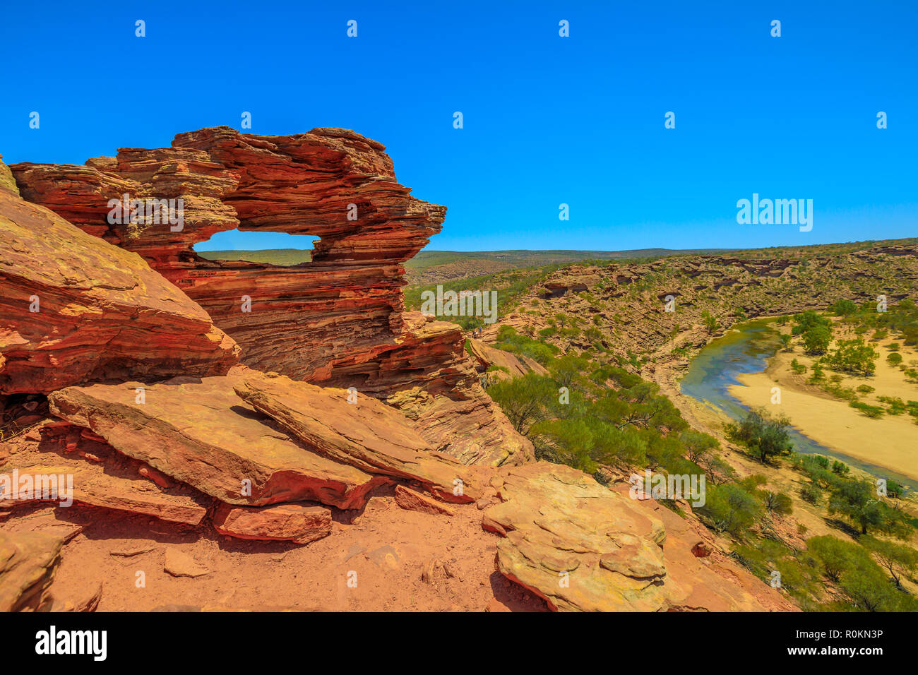 Aerial view of rocks rippled with red and white banded of Nature’s Window over Murchison River Gorge, the most iconic natural attraction in Western Australia.Popular walk trail, Kalbarri National Park Stock Photo