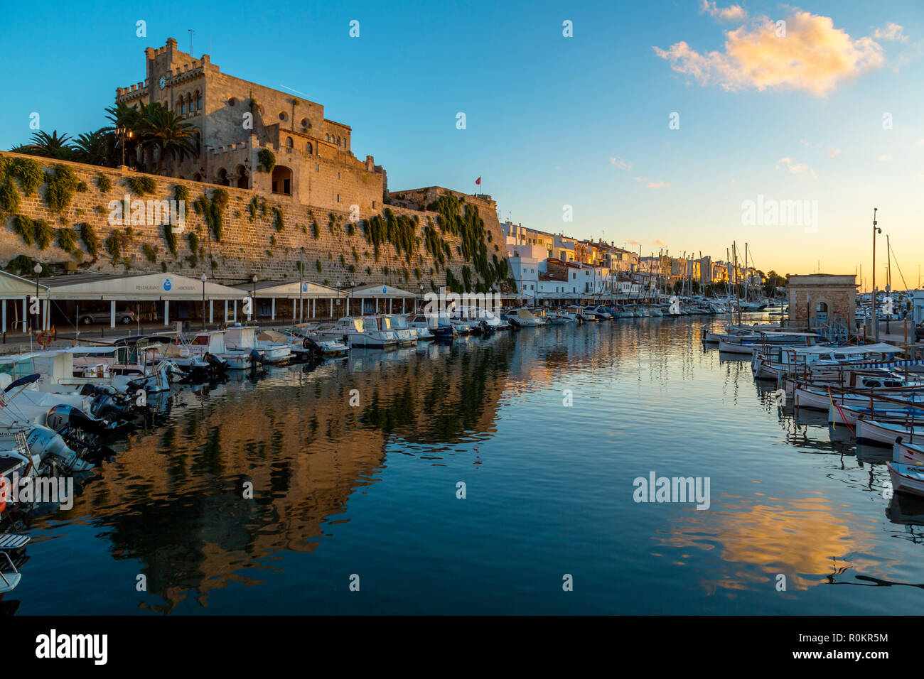Traditional harbour of Ciutadella de Menorca.Over the harbour is the City Hall Stock Photo
