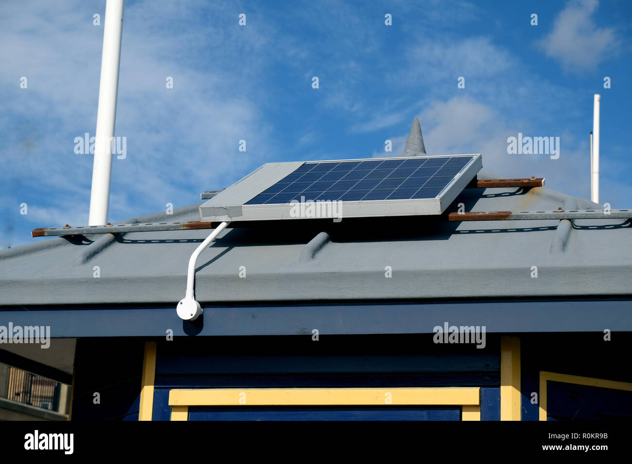 Solar energy electrical panel on coastguard station roof on UK east coast. Stock Photo