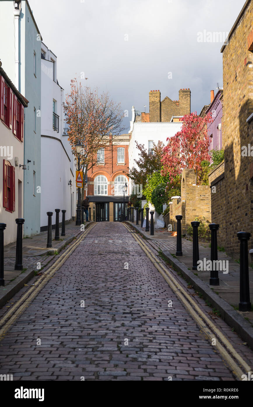Back Lane, a pretty, narrow, cobbled street of houses in Hampstead, London, England, UK Stock Photo