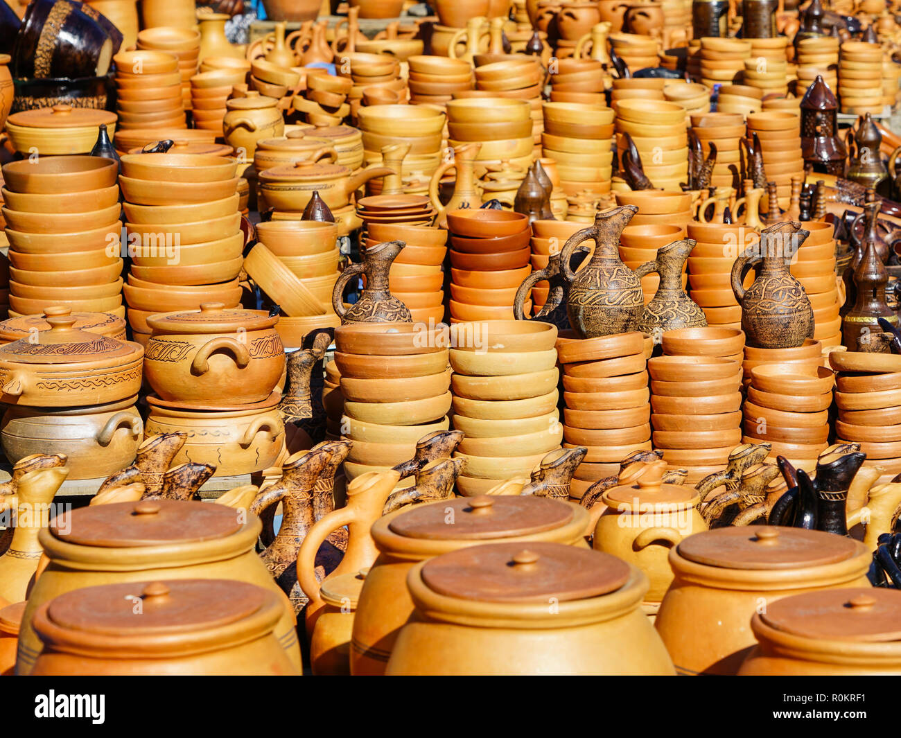 traditional handmade clay pottery on display at street market