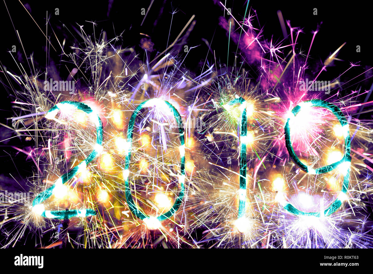 New Year 2019. Sparkler fireworks number 2019 burning. Vibrant, colorful full of energy. Copy space at top. Stock Photo