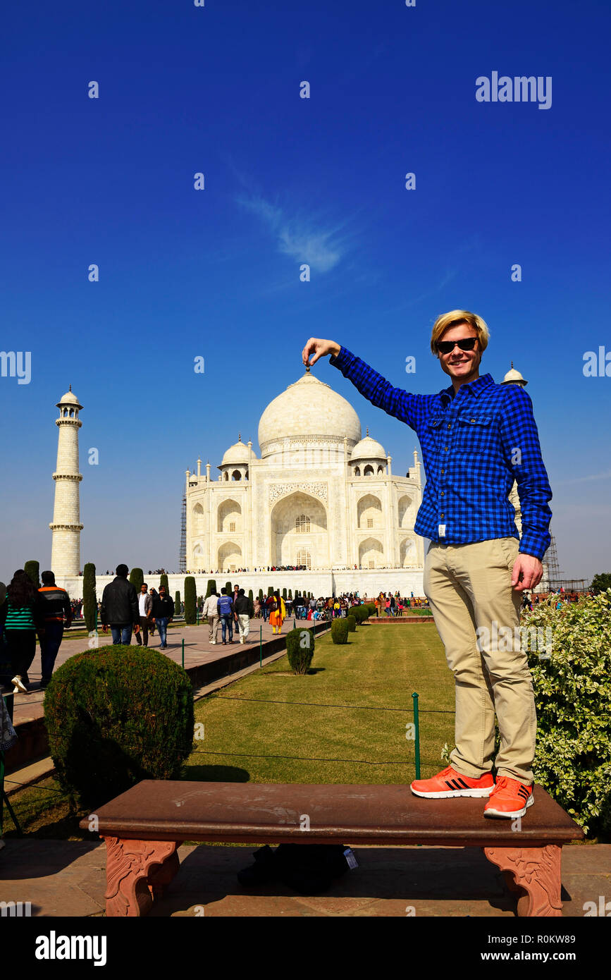 European tourist in front of the Taj Mahal, Agra, Uttar Pradesh, India Stock Photo